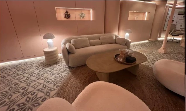Ansa Coffee: Lounge seating around a wooden coffee table over patterned flooring