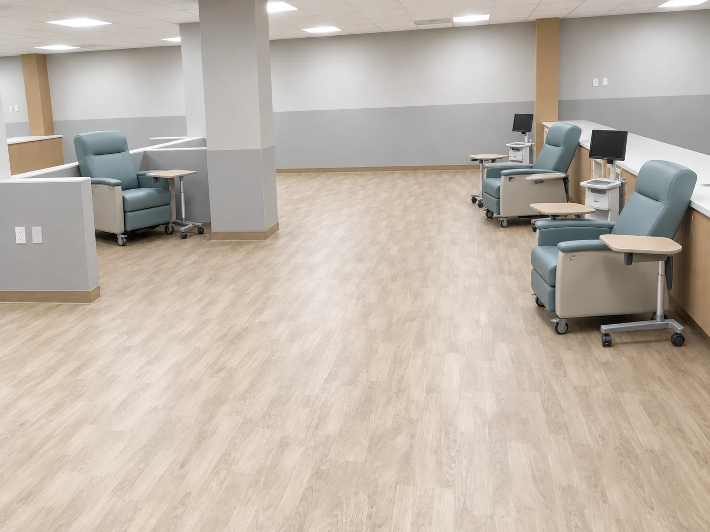 Brooklyn DaVita: Treatment area with reclining chairs, side tables, and individual monitors