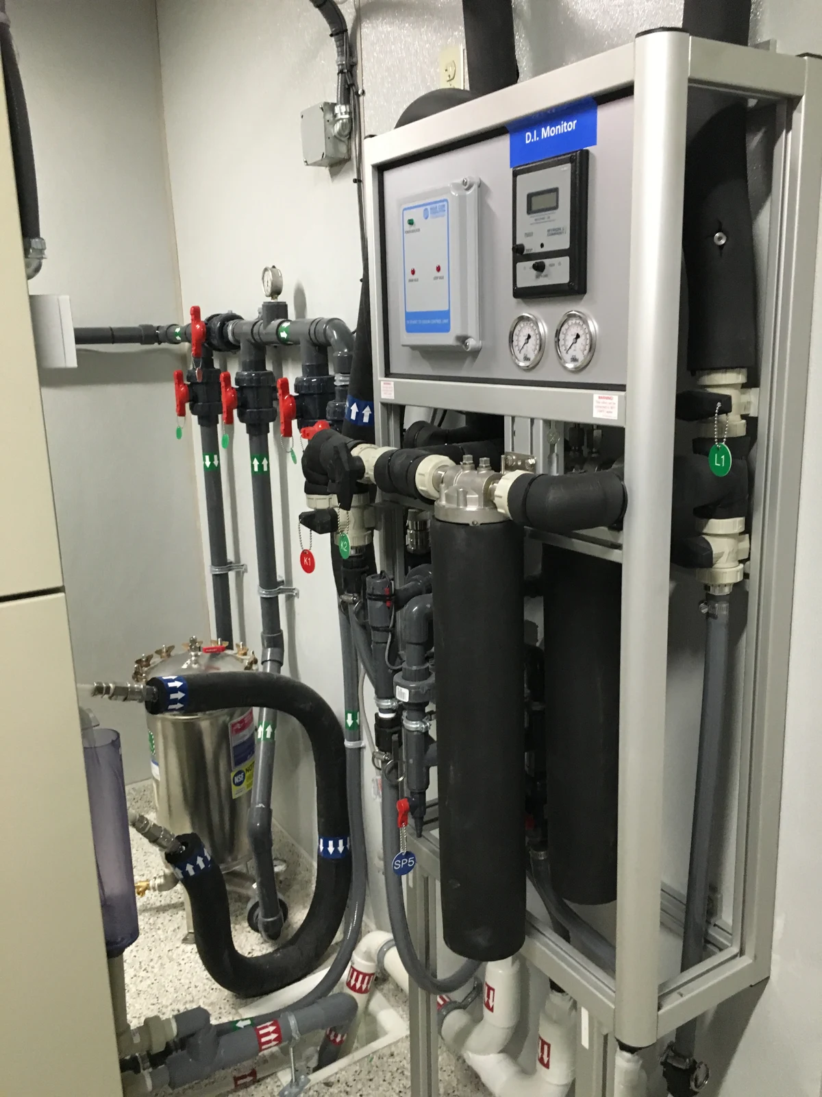 Brooklyn DaVita: Water-treatment equipment with pressure gauges, control panels, and connected piping