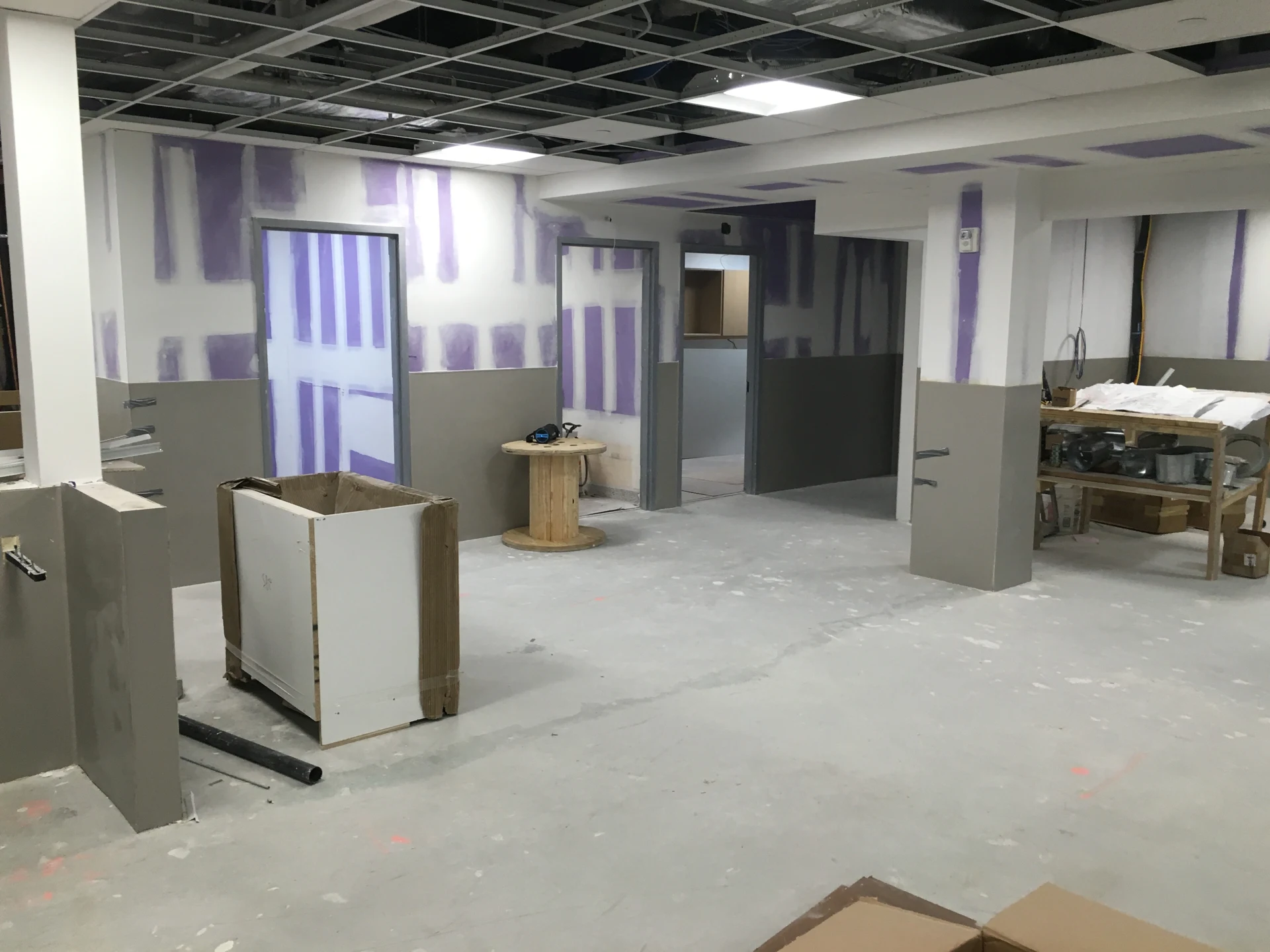 Brooklyn DaVita: Interior under construction with unfinished walls and an exposed ceiling grid