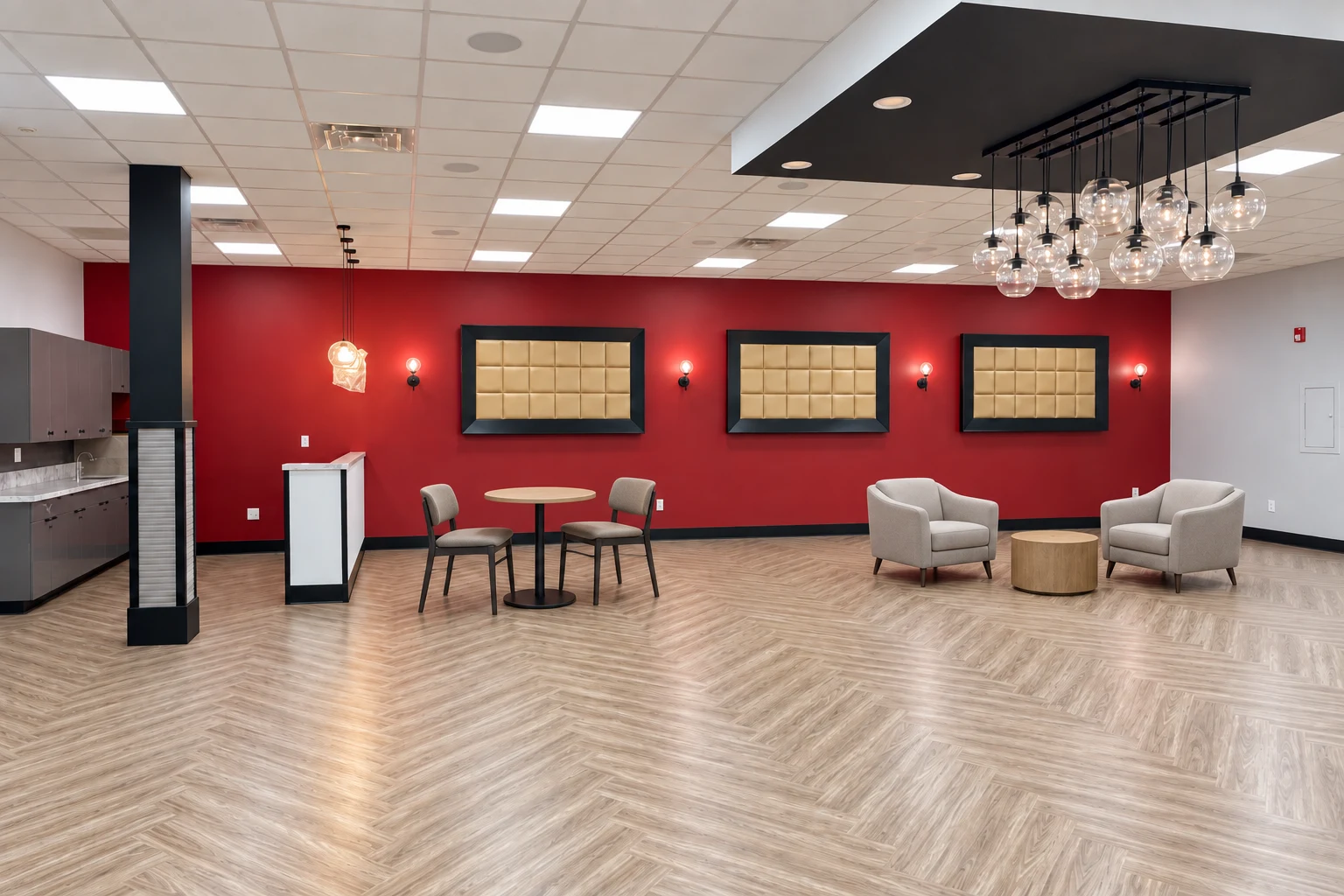 Generations Plus: Seating area with a red accent wall, globe pendants, and herringbone flooring