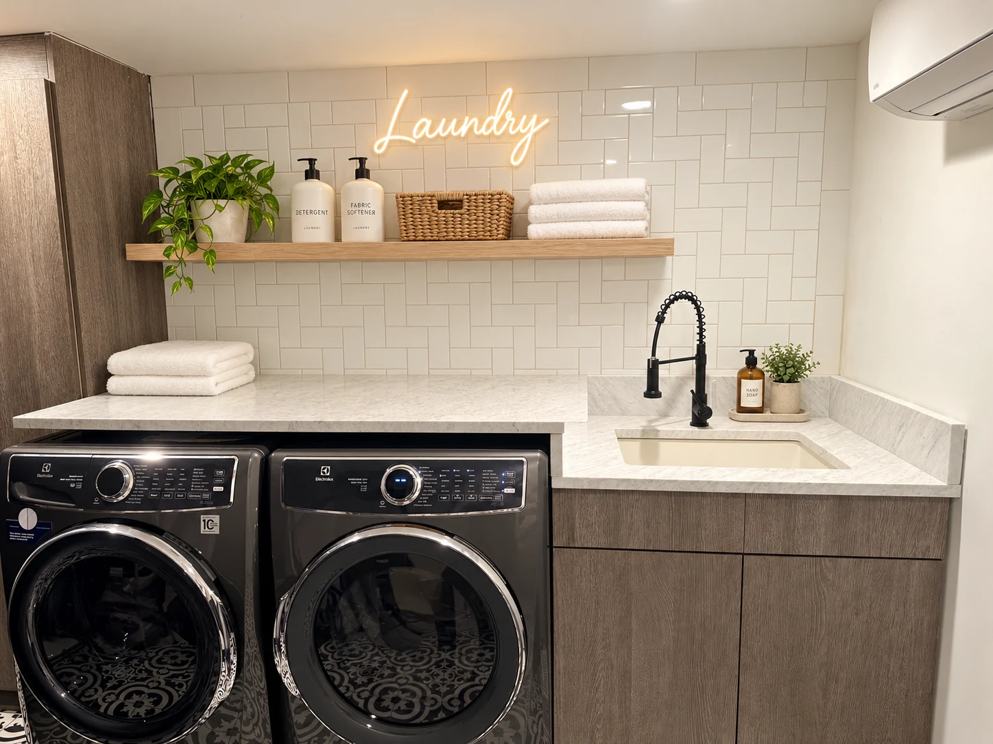 Residential Interiors: Laundry area with front-loading machines, a utility sink and wood cabinetry